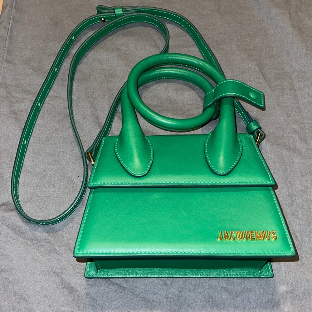 An gently used green Jacquemus crossbody purse.